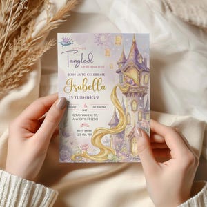 A person's hands holding a birthday invitation for a girl named Isabella, who is turning 5 years old.