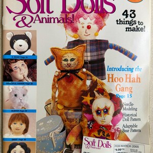 May include: A Soft Dolls & Animals magazine cover from February/March 2000 featuring various fabric dolls and stuffed animals. The cover displays text including 43 things to make, Introducing the Hoo Hah Gang, and a pullout section of patterns.