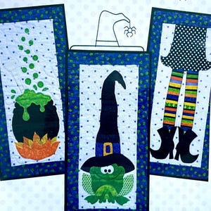 May include: Three Halloween-themed fabric panels. One features a cauldron with green bubbling liquid, another a witch's hat with a frog, and the last, witch legs. Each panel has a blue border with white polka dots and stars.