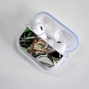 May include: White wireless earbuds in a clear case with a blue border. The case features an anime character graphic with white hair, a green eye, and a menacing smile. The background is green and black.