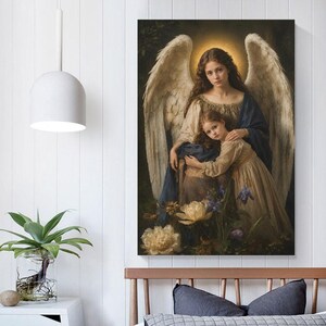 May include: A wall art print depicting a guardian angel with large feathered wings and a glowing halo, embracing a young child. Both figures wear flowing, earth-toned garments. The scene is set against a dark, moody background with flowers.