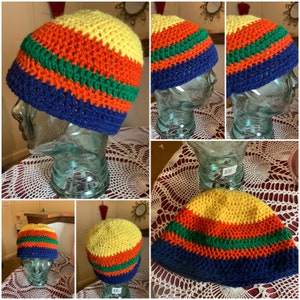 May include: A crocheted beanie hat with stripes of yellow, orange, green, and blue.