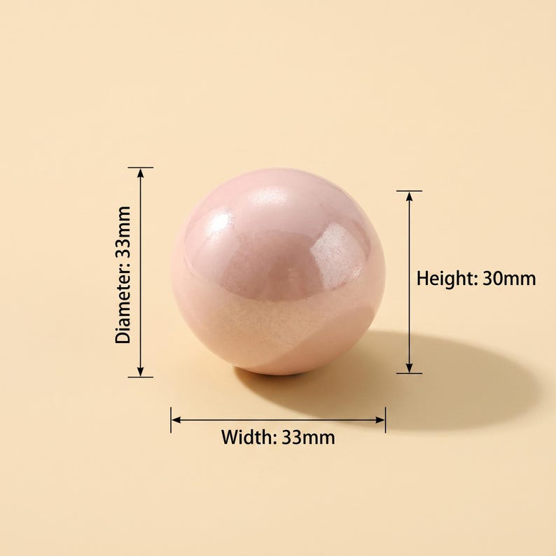 May include: A smooth, pale pink spherical object with a glossy finish. Technical annotations indicate a diameter of 33mm, a width of 33mm, and a height of 30mm. The object is presented against a solid, light-colored background with clear measurement lines.