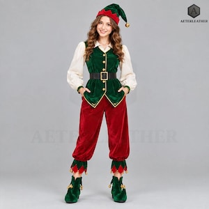 May include: A velvet elf costume featuring a green vest with gold buttons, a white long-sleeve shirt, red trousers with green pointed cuffs, a matching green hat with a gold bell, and green boots with gold bells. The AETERLEATHER logo is visible.