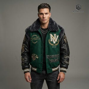 May include: Green and black varsity jacket with a faux fur collar. The jacket features embroidered patches, including "NV" with a laurel wreath, and the text "NAUVEAU VAGUE". The sleeves are black leather, and the jacket has a striped hem.