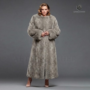 May include: Full-length, faux fur coat in a neutral color palette. The coat features a chevron pattern and a round neckline. The sleeves are long and wide. The coat is worn by a person wearing high heels.