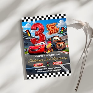 Lifestyle mockup of the Cars racing invitation placed on a neutral surface next to a decorative dried branch. Highlights the modern and professional graphic design for a boy’s third birthday party.