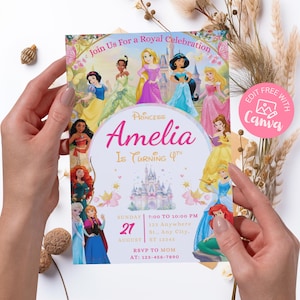 Hands holding a printed 5x7 princess birthday invitation, demonstrating the physical scale and vibrant pink colors. Features classic fairy tale princesses and a golden castle on high-quality printed paper.