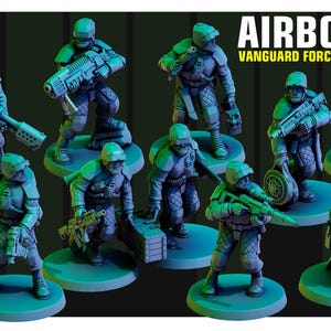 May include: A collection of miniature figurines of soldiers in futuristic armor, posed on circular bases. The figures are predominantly teal and gray, with weapons and gear. The text "AIRBORNE VANGUARD FORCE" is displayed in white.