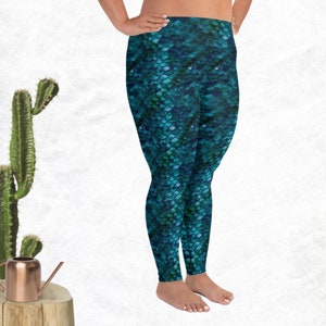 May include: Teal blue leggings with a mermaid scale pattern.
