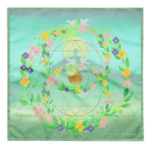 May include: Square silk scarf with a watercolour design. The scarf features a floral wreath with pink, yellow, and purple flowers, geometric shapes, and doves. The background has a gradient of green and blue.