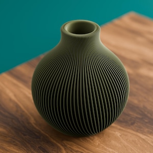 May include: A spherical olive green vase featuring a distinct ribbed texture with vertical lines running from the narrow circular opening down to the base, creating a consistent pattern across the entire rounded exterior surface of the object.