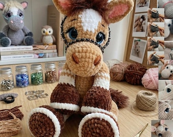 May include: A handmade crochet horse plushie in shades of brown, white, and tan, with a dark brown mane and a white blaze. The horse has large blue eyes and a black bridle. Other crochet items and supplies are in the background.