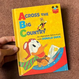 vintage Donald Duck childrens alphabet book ACROSS The BIG COUNTRY - Disney hardcover