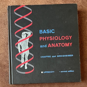 May include: A black hardcover textbook titled BASIC PHYSIOLOGY and ANATOMY by Chaffee and Greisheimer, second edition, published by Lippincott. The cover features a white line drawing of a human figure encircled by a red and gray helix design.
