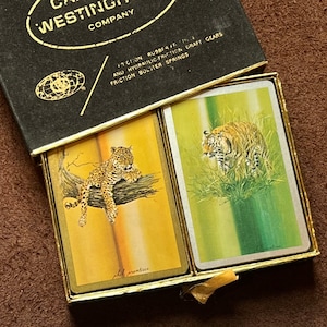 Dos barajas de naipes vintage de grandes felinos