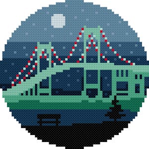 May include: A circular cross-stitch pattern depicting a light green suspension bridge at night. The scene features a dark blue sky with a white moon, red and white lights on the bridge cables, a black bench, and a small black pine tree silhouette.