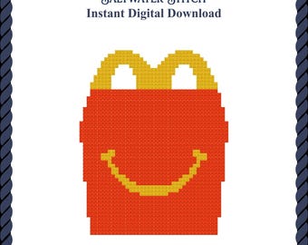 May include: A pixel art cross stitch pattern of a red box with yellow handles and a yellow smiling mouth. The text at the top reads Saltwater Stitch and Instant Digital Download. The entire design is framed by a dark blue rope border.