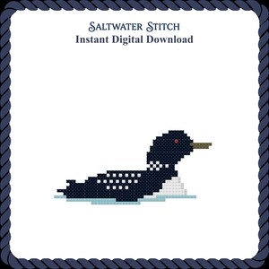 May include: A cross-stitch pattern featuring a dark blue loon with white spots, a red eye, and a tan beak, floating on light blue water. The text reads Saltwater Stitch Instant Digital Download, framed by a dark blue rope border.