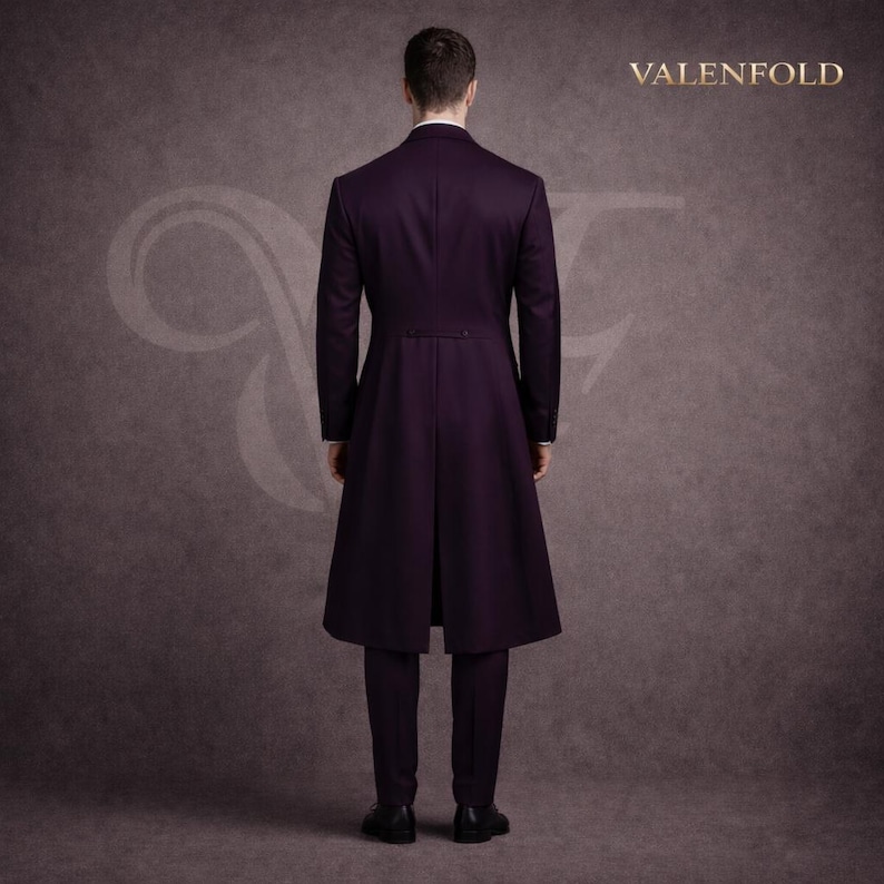 May include: A formal, dark purple tailcoat suit with a long, flowing coat and matching trousers. The suit is tailored with a classic design, featuring a buttoned back and a refined silhouette. The brand name "VALENFOLD" is displayed in gold lettering.