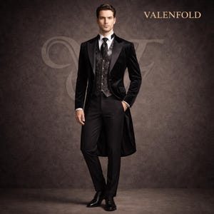 May include: A formal black velvet tailcoat suit with a patterned vest, white dress shirt, and black tie. The suit is worn with black dress pants and shoes. The word "VALENFOLD" is printed in the upper right corner.