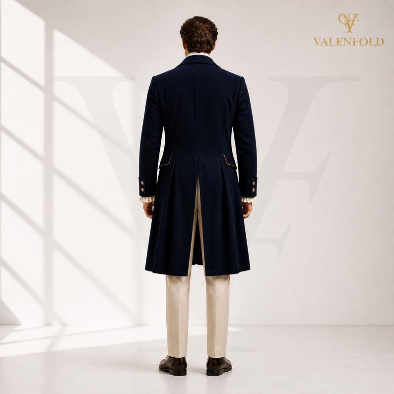 May include: A navy blue long coat with gold trim and buttons, paired with cream-colored trousers. The coat features a split back and is part of a formal outfit. The Valenfold logo is visible in the upper right corner.