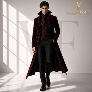 May include: A burgundy velvet coat with a wide collar, paired with a matching vest and black trousers. The coat features ornate detailing on the sleeves and is buttoned up. The outfit is completed with a black shirt and tie.