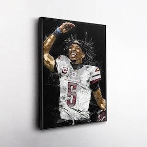 May include: Framed art print of a football player in a white jersey with the number 5 and the word "WASHINGTON". The player is raising his arm in celebration against a black background.