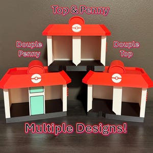 May include: Three 3D-printed structures resembling buildings with red roofs, white walls, and black bases. Each features a circular emblem on the roof. Text labels read Top & Penny, Douple Penny, Douple Top, and Multiple Designs! in red and white font.