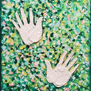 May include: Abstract painting with two white handprints on a textured background of green, yellow, and pink brushstrokes. The artwork is signed "Nelajova" and dated "2023". The painting has a dark green border.