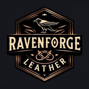 May include: A black and gold Ravenforge Leather logo. The design includes a raven above the words "Ravenforge" and "Leather". The logo has a vintage, handcrafted aesthetic, with decorative elements and a shield-like shape.