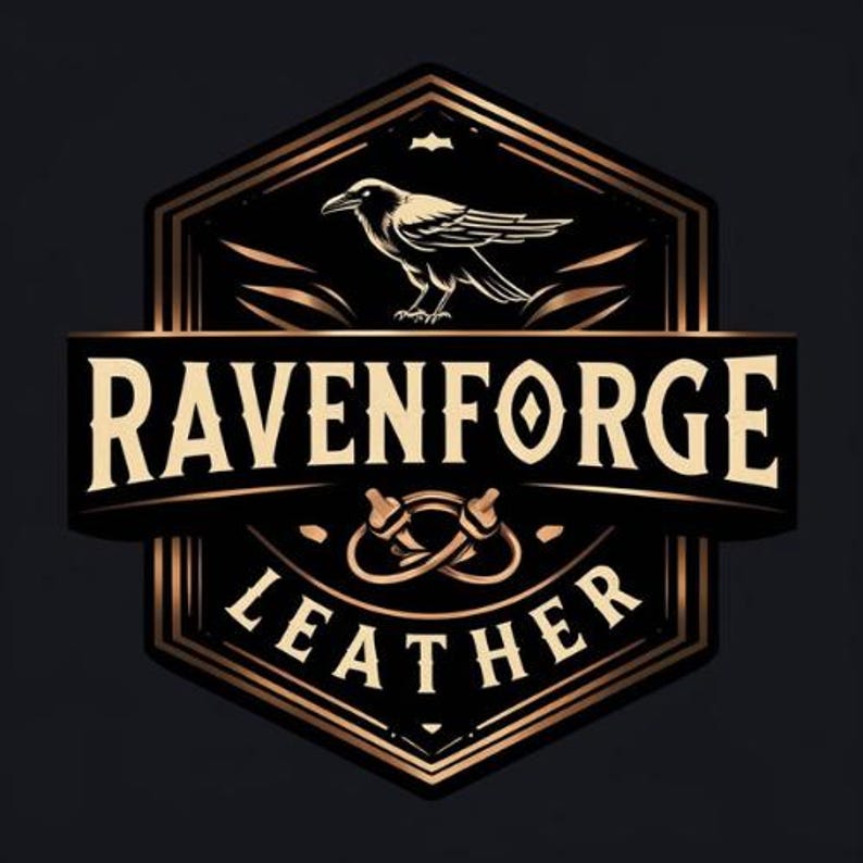 May include: A black and gold Ravenforge Leather logo. The design includes a raven above the words "Ravenforge" and "Leather". The logo has a vintage, handcrafted aesthetic, with decorative elements and a shield-like shape.