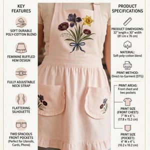 May include: A light pink ruffled apron with a floral design, made from a soft poly-cotton blend. The apron has two front pockets and measures 81 cm long by 76 cm wide.