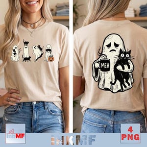 May include: A beige t-shirt featuring a front graphic of four white ghosts interacting with black cats and a pumpkin, and a back graphic of a large white ghost holding a black cat and a black mug with the text MEH printed on it.