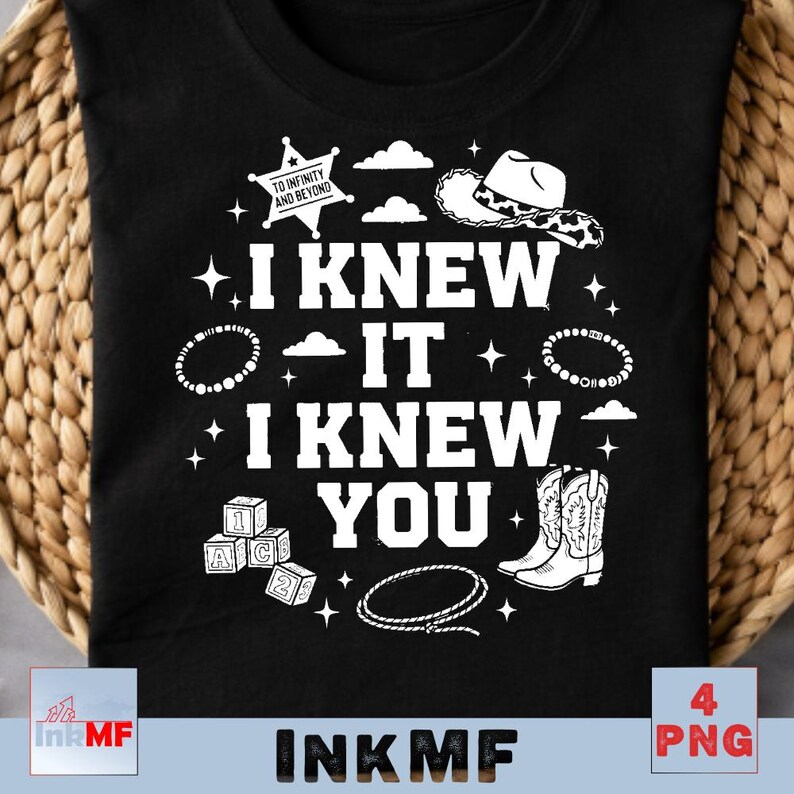 May include: A black t-shirt featuring white graphic elements including a sheriff star with the text TO INFINITY AND BEYOND, a cowboy hat, cowboy boots, a lasso, alphabet blocks, and the text I KNEW IT I KNEW YOU surrounded by small stars and clouds.