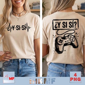 May include: A beige t-shirt featuring a black graphic on the front with the text ¿Y SI SÍ? integrated into a heartbeat line. The back displays a black graphic of a video game controller with the text ¿Y SI SÍ? inside a rectangular box.
