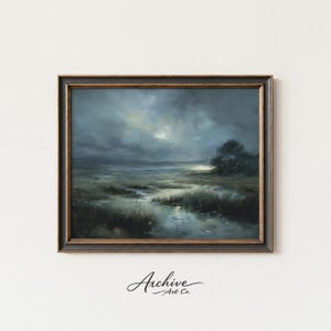 May include: An oil painting of a marsh landscape under a stormy sky, framed in a dark, ornate frame. The artwork features a muted color palette of blues, greens, and grays, with the text "Archive Art Co." in the lower left corner.