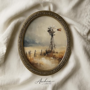 May include: An oval, framed painting depicts a rural landscape with a windmill, fence, and field. The artwork features a muted color palette of browns, tans, and grays, with a cloudy sky. The frame is gold-toned, and the text "Archive Art Co." is at the bottom.