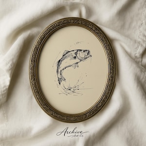 May include: An oval, antique gold-coloured frame surrounds a pen and ink drawing of a fish leaping out of water. The fish is black and white, with details of water droplets and splashes. The artwork is on a cream-coloured background. The words "Archive Art Co." are at the bottom.