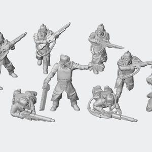 Puede incluir: Un conjunto de figuras en miniatura grises que representan soldados con armaduras futuristas, armados con rifles y otras armas. Algunas figuras están de pie, otras arrodilladas o agachadas, lo que sugiere acción y combate. El tema general es la ciencia ficción o la fantasía.