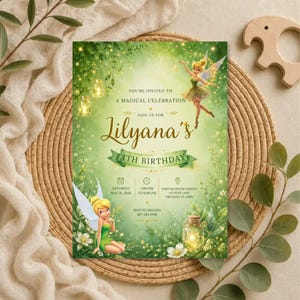 May include: A rectangular birthday invitation card featuring a green forest theme with two fairies, glowing lanterns, and white flowers. The text reads: You're invited to a magical celebration, join us for Lilyana's 4th birthday, Saturday May 31, 2026.