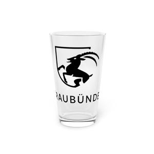 May include: A clear pint glass with a black graphic of a mountain goat inside a shield. The text "RAUBÜNDE" is printed below the graphic. The glass is empty and sits on a white surface.