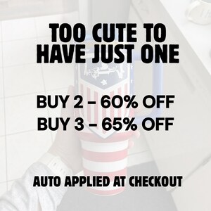 May include: A tall, insulated tumbler featuring a red, white, and blue patriotic striped design with a shield emblem. The text reads: TOO CUTE TO HAVE JUST ONE, BUY 2 &ndash; 60% OFF, BUY 3 &ndash; 65% OFF, AUTO APPLIED AT CHECKOUT. The tumbler has a blue handle.