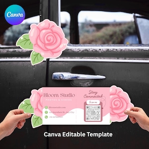 May include: Pink rose stickers with green leaves frame a business card with the text "Bloom Studio PHOTOS & VIDEOS". The card includes contact information and a QR code. The Canva logo is in the upper left corner. The words "Canva Editable Template" are at the bottom.