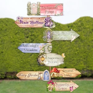 May include: A vertical wooden signpost featuring multiple directional arrows with illustrations of doors, mushrooms, and flowers. The signs are labelled Enchanted Forest, Pixie Hollow, Wishmaker's Grove, Moonlight Meadow, Whispering Woods, Fairy Garden, Gnome Land, and Butterfly Grove.