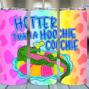 May include: Three colorful 20 oz. stainless steel tumblers with lids and straws. Each tumbler features a unique design. One is pink with heart shapes, another has the text "HOTTER THAN A HOOCHIE COOCHIE" with an alligator, and the last is yellow and pink.