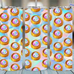 May include: A set of three stainless steel tumblers with a repeating pattern of cartoon dumplings in bamboo steamers. The dumplings are pastel colors with smiling faces, set against a holographic background. The tumblers have a straw and a lid.