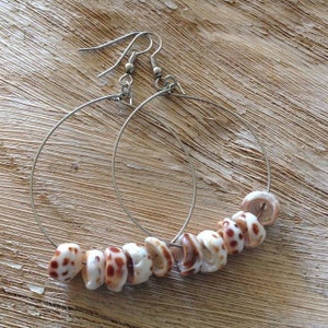 Puka shell hoop earrings.