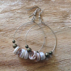 Puka shell hoop earrings.