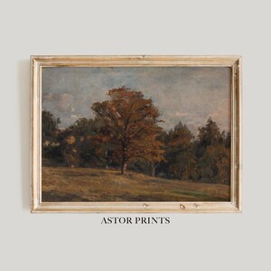 Könnte beinhalten: Gerahmtes Landschaftsgemälde mit einem Baum mit orange-braunen Blättern auf einer Wiese. Das Kunstwerk hat eine Vintage-Ästhetik mit bewölktem Himmel und Holzrahmen. Der Text "ASTOR PRINTS" befindet sich unten.